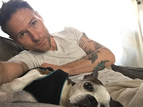 Joshua Marie Wilkinson with a Boston terrier